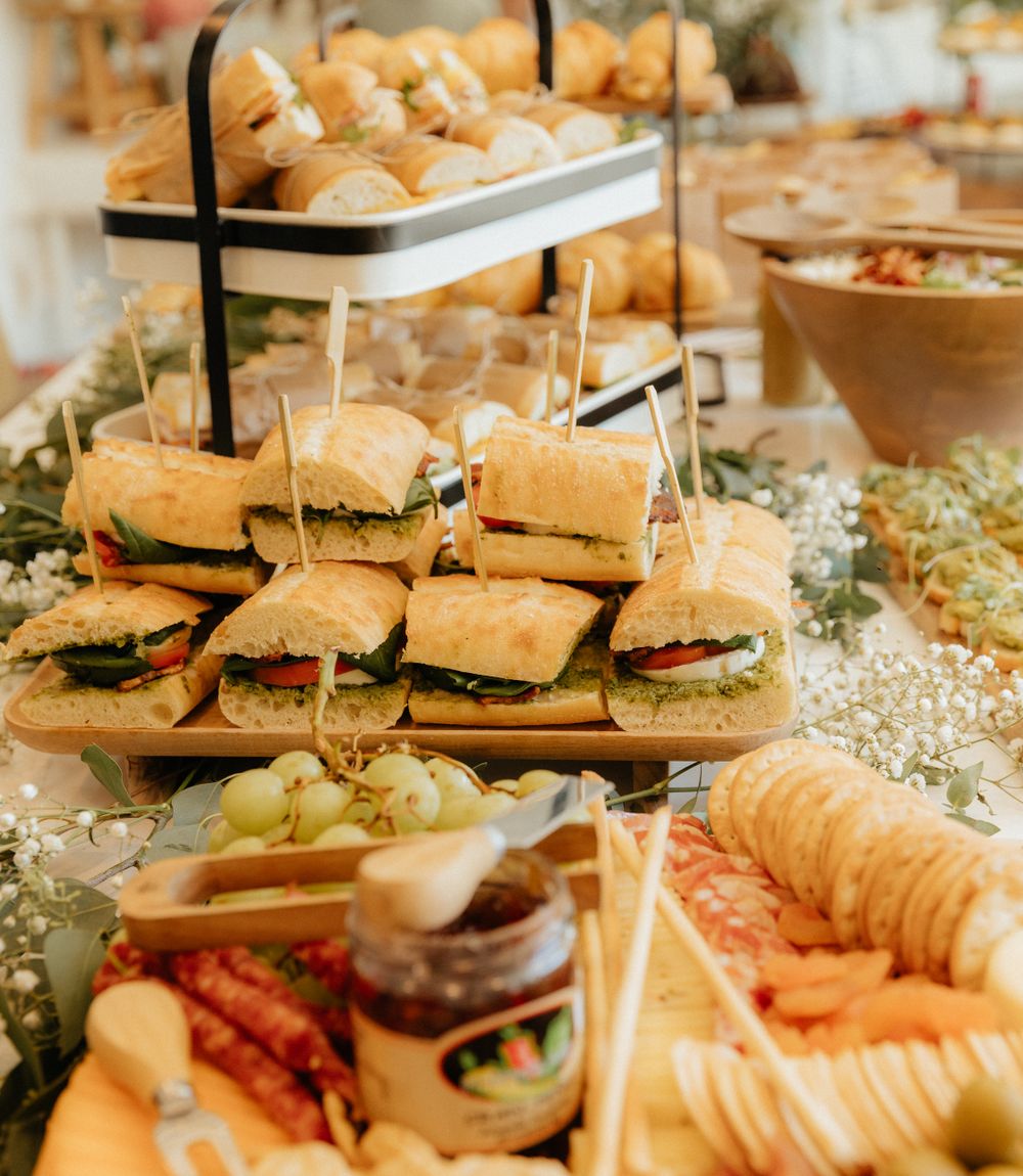 Platters of sandwiches laid out for an event